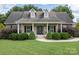 Brick ranch home with front porch and landscaping at 114 Market St, Rockwell, NC 28138