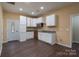 Efficient kitchen featuring white cabinets and granite countertops at 1021 Wall St, Statesville, NC 28677