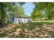 Gray house exterior with a spacious yard and mature trees at 1021 Wall St, Statesville, NC 28677