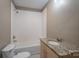 Clean bathroom with a granite countertop and a bathtub at 1021 Wall St, Statesville, NC 28677