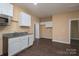 Open kitchen with ample cabinet space and microwave at 1021 Wall St, Statesville, NC 28677