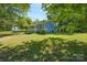 Gray house exterior with a front porch and lush green lawn at 1021 Wall St, Statesville, NC 28677