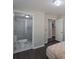 Main bedroom with dark hardwood floors and an ensuite bathroom at 1021 Wall St, Statesville, NC 28677