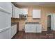 White cabinets, granite countertops, and stainless steel appliances at 1021 Wall St, Statesville, NC 28677