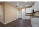 White kitchen cabinets, granite counters, and exterior door at 1021 Wall St, Statesville, NC 28677