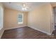 Simple spare bedroom with laminate wood flooring and a ceiling fan at 1021 Wall St, Statesville, NC 28677