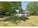 House with backyard and large trees at 1021 Wall St, Statesville, NC 28677