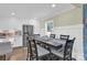 Kitchen dining area with dark wood table and six chairs at 6639 Ronda Ave, Charlotte, NC 28211