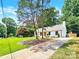 Charming white house with a well-manicured lawn and driveway at 6639 Ronda Ave, Charlotte, NC 28211