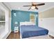 Serene bedroom with a blue accent wall and plenty of natural light at 6639 Ronda Ave, Charlotte, NC 28211