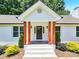 Front entry with wood columns and stone flooring at 6639 Ronda Ave, Charlotte, NC 28211