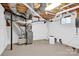 Unfinished basement with exposed pipes and HVAC system at 6639 Ronda Ave, Charlotte, NC 28211