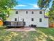 Back of house, deck, fenced yard, and mature trees at 6639 Ronda Ave, Charlotte, NC 28211