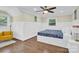 Bright bedroom with hardwood floors and a ceiling fan at 6639 Ronda Ave, Charlotte, NC 28211