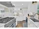 Modern kitchen with stainless steel appliances and white cabinets at 6639 Ronda Ave, Charlotte, NC 28211