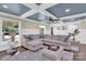 Spacious living room featuring a sectional sofa, stylish coffee table, and coffered ceiling at 6639 Ronda Ave, Charlotte, NC 28211