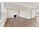 Spacious living room with hardwood floors and fireplace at 1016 Briar Well St, Mint Hill, NC 28227