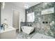 Modern bathroom with a soaking tub, double vanity, and marble at 205 W Phifer St, Monroe, NC 28110