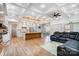 Open concept kitchen and living room with island, hardwood floors, and coffered ceiling at 205 W Phifer St, Monroe, NC 28110