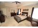 Spacious main bedroom with a ceiling fan and ample natural light at 6929 Plough Dr, Charlotte, NC 28227