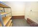 Storage room with wire shelving units and brick accent wall at 6929 Plough Dr, Charlotte, NC 28227