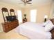 Bedroom with double bed, dresser and ceiling fan at 6929 Plough Dr, Charlotte, NC 28227
