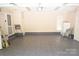 Spacious two-car garage with tiled floor and ample storage at 6929 Plough Dr, Charlotte, NC 28227
