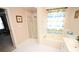 Bathroom features a shower and tub combo at 6929 Plough Dr, Charlotte, NC 28227