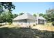 House exterior with a screened porch and landscaped yard at 6929 Plough Dr, Charlotte, NC 28227