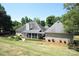 House exterior with a screened porch and landscaped yard at 6929 Plough Dr, Charlotte, NC 28227