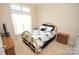 Bright bedroom with a double bed and wood nightstand at 6929 Plough Dr, Charlotte, NC 28227