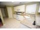 Kitchen boasts granite countertops, white cabinets, and stainless steel appliances at 6929 Plough Dr, Charlotte, NC 28227