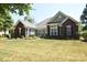 Brick and siding ranch home with landscaped yard at 6929 Plough Dr, Charlotte, NC 28227