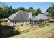 House exterior with a screened porch and landscaped yard at 6929 Plough Dr, Charlotte, NC 28227