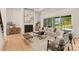 Living room features a fireplace, hardwood floors, and natural light at 609 Marvin Rd, Marvin, NC 28173