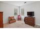 Bedroom with two windows, a dresser, and musical instruments at 9037 Castlebay Dr, Charlotte, NC 28277