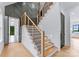 Modern staircase with wood and metal accents at 18304 Rosapenny Rd, Charlotte, NC 28278