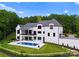 Stunning pool and backyard area of the house with beautiful landscaping at 18304 Rosapenny Rd, Charlotte, NC 28278