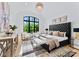 Large bedroom with plush bed, stylish decor, and big windows at 18304 Rosapenny Rd, Charlotte, NC 28278