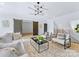 Spacious living room with cozy seating and barn doors at 18304 Rosapenny Rd, Charlotte, NC 28278