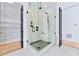 Spa-like bathroom with a large walk-in shower and marble tile at 18304 Rosapenny Rd, Charlotte, NC 28278