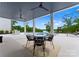 Relaxing covered patio area with a pool and lake view at 18304 Rosapenny Rd, Charlotte, NC 28278