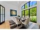 Bright dining area with large windows and wood floors at 18304 Rosapenny Rd, Charlotte, NC 28278