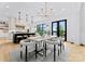 Elegant dining room with modern chandelier and lake views at 18304 Rosapenny Rd, Charlotte, NC 28278