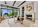Light and airy living room with fireplace and lake views at 18304 Rosapenny Rd, Charlotte, NC 28278