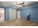 Bedroom with light blue walls, carpet, and a large closet at 213 Press Sweezy Rd, Kings Mountain, NC 28086