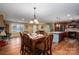 Open concept kitchen and dining area with hardwood floors and an island at 213 Press Sweezy Rd, Kings Mountain, NC 28086
