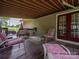 Relaxing deck with retractable awning, outdoor furniture, and tranquil view at 213 Press Sweezy Rd, Kings Mountain, NC 28086