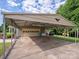 Covered carport with ample parking and ceiling fan at 213 Press Sweezy Rd, Kings Mountain, NC 28086
