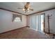 Spacious bedroom with carpet, window, and sliding door at 2501 Twin Ave, Gastonia, NC 28052